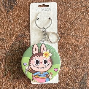 Double mirror compact keychain with Labubu character